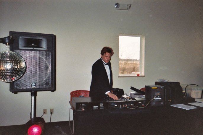 Photograph of DJ Scotty Boman at work.