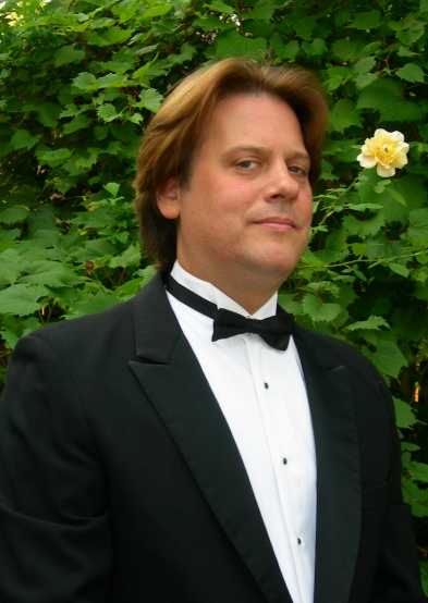 Outdoor photograph of DJ Scotty Boman in tuxedo.